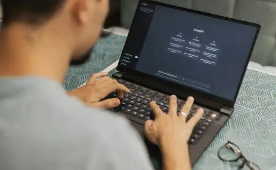Employee using an AI chatbot on a laptop