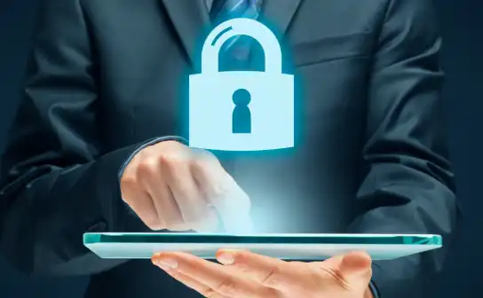 Businessman with a glowing padlock above a tablet